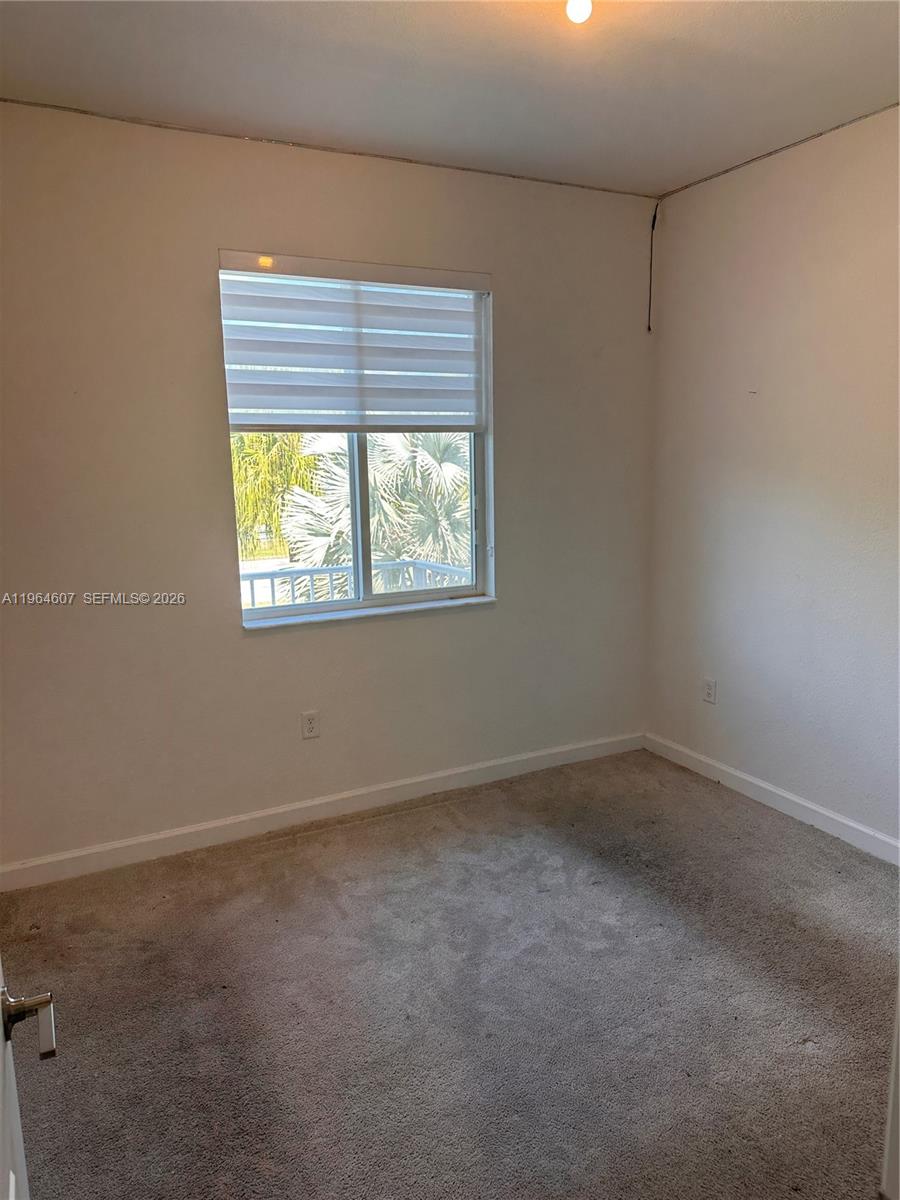 623 Southeast 13th St Circle Homestead, FL 33034 - Photo 20 of 28 an empty room with windows