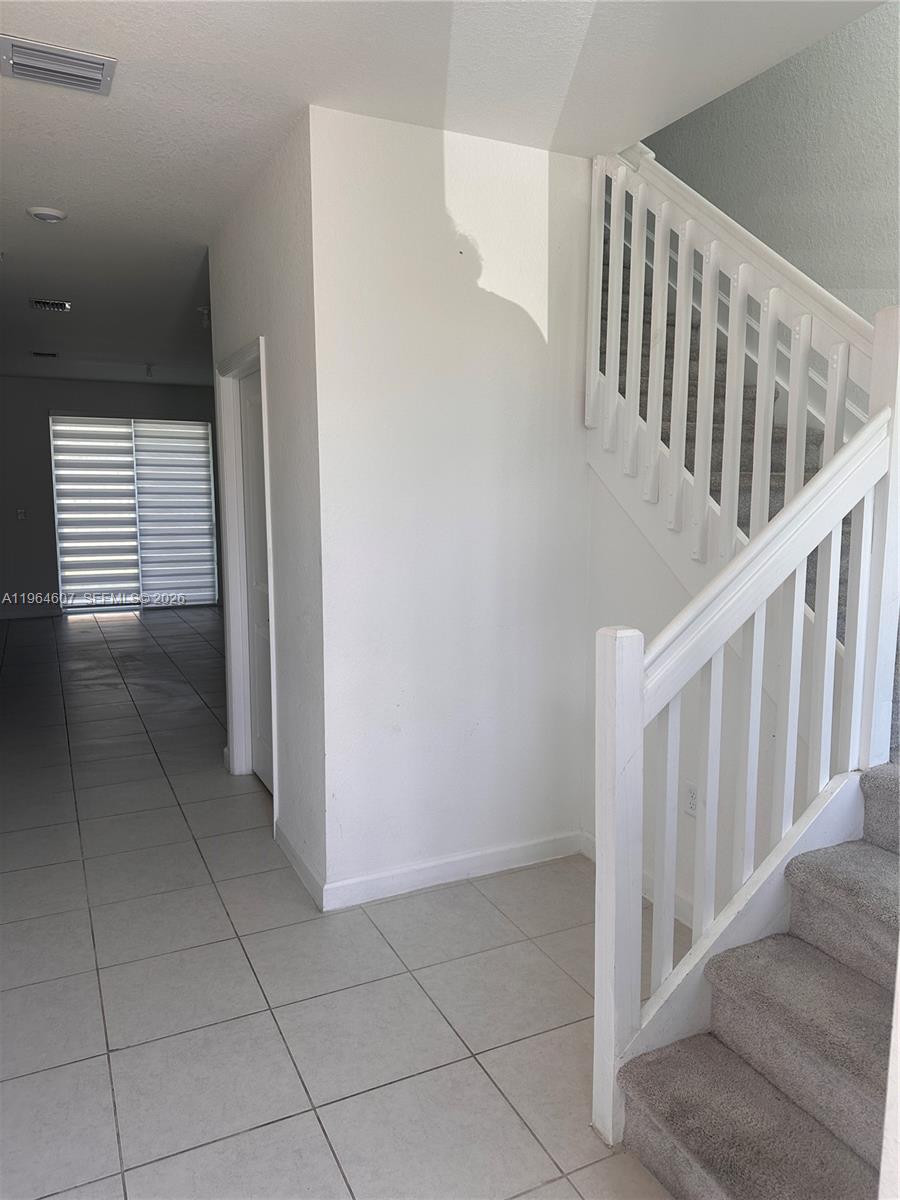623 Southeast 13th St Circle Homestead, FL 33034 - Photo 2 of 28 a view of entryway with stairs
