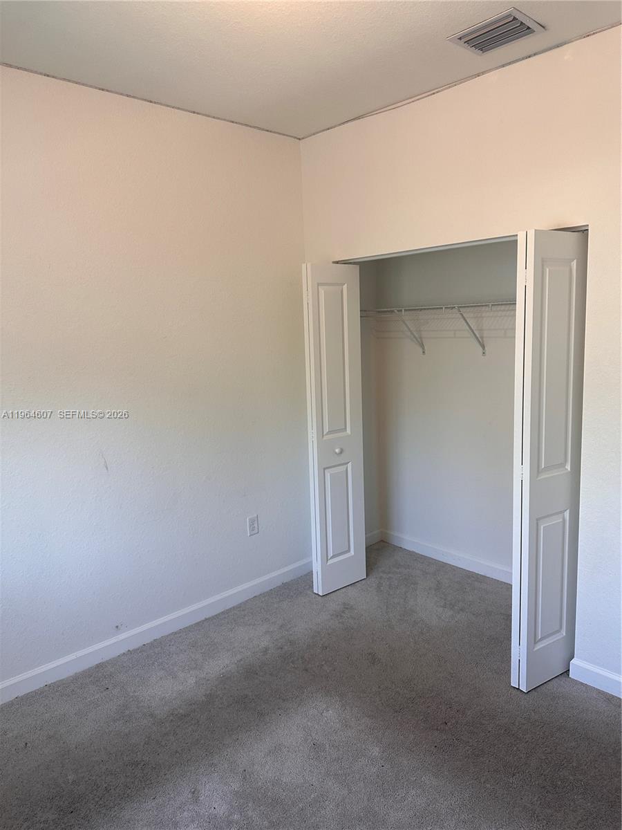 623 Southeast 13th St Circle Homestead, FL 33034 - Photo 21 of 28 a view of an empty room