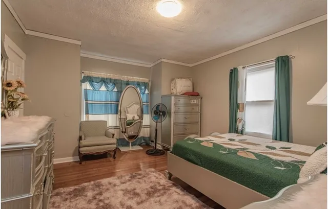 a living room with couch and a dining table