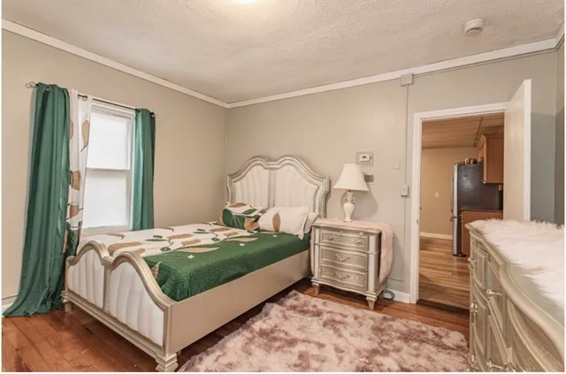 a bedroom with a bed and a cabinets