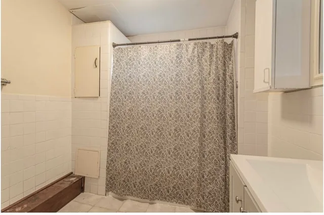 a bathroom with a shower and a bathtub