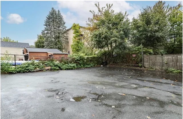 a view of a house with a backyard