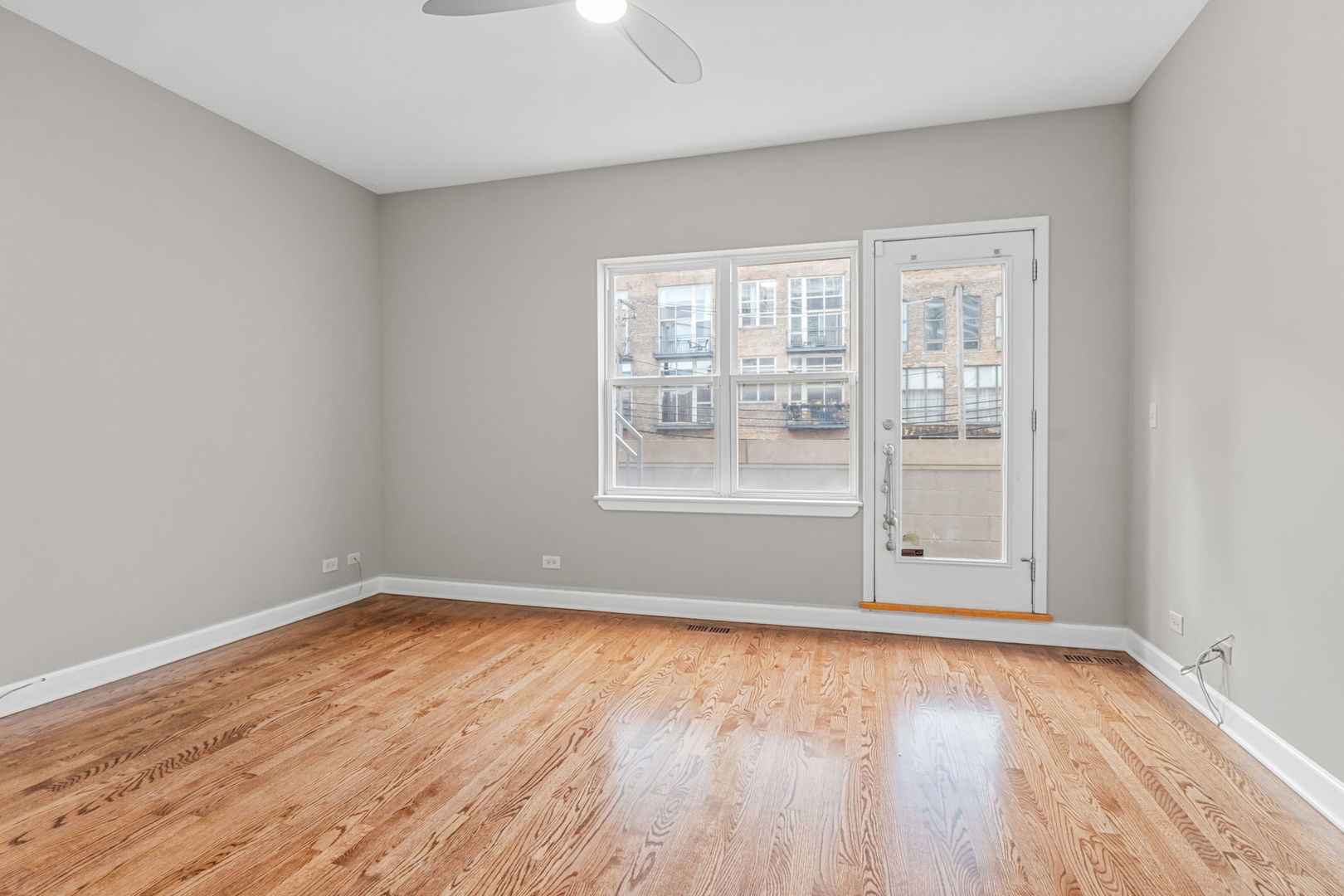 1616 South Indiana Avenue, Unit B3 Chicago, IL 60616 - Photo 14 of 32 wooden floor in an empty room with a window