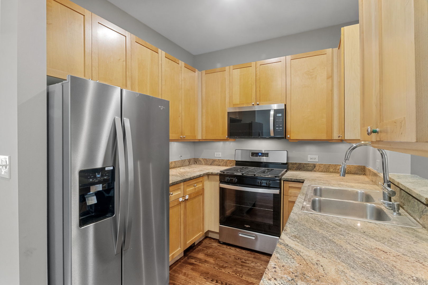 1616 South Indiana Avenue, Unit B3 Chicago, IL 60616 - Photo 7 of 32 a kitchen with stainless steel appliances granite countertop a refrigerator stove and oven