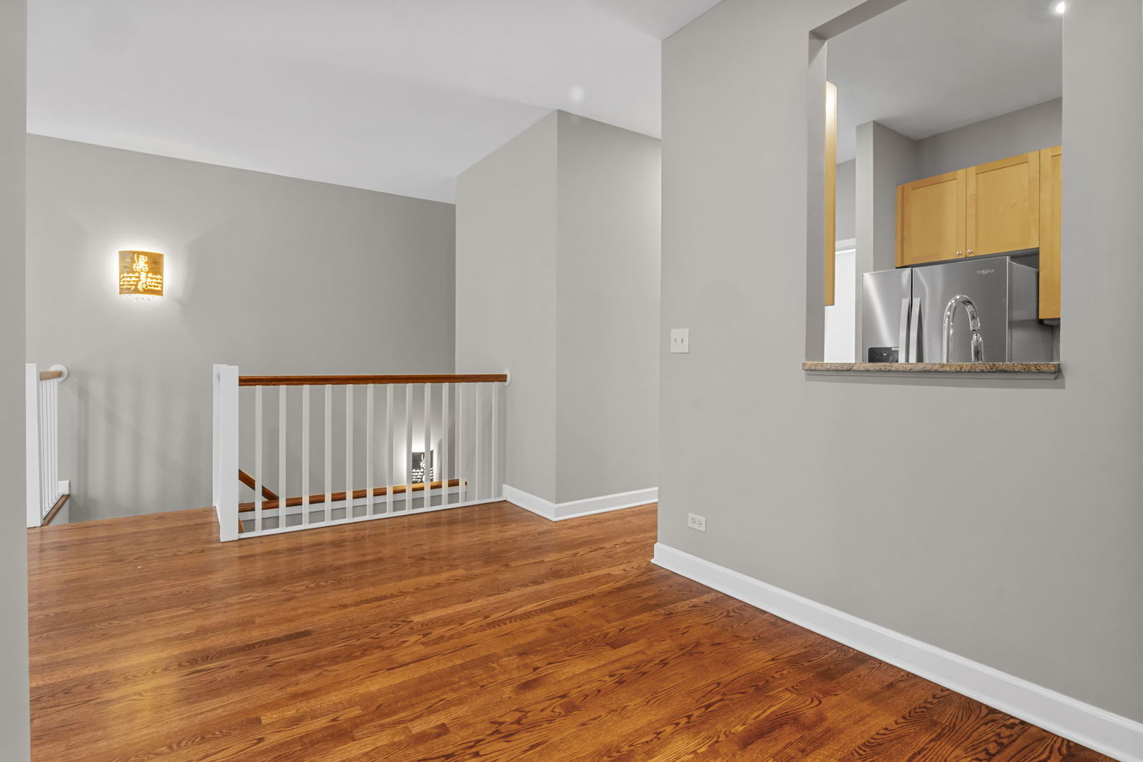 1616 South Indiana Avenue, Unit B3 Chicago, IL 60616 - Photo 9 of 32 a view of a room with wooden floor and a window