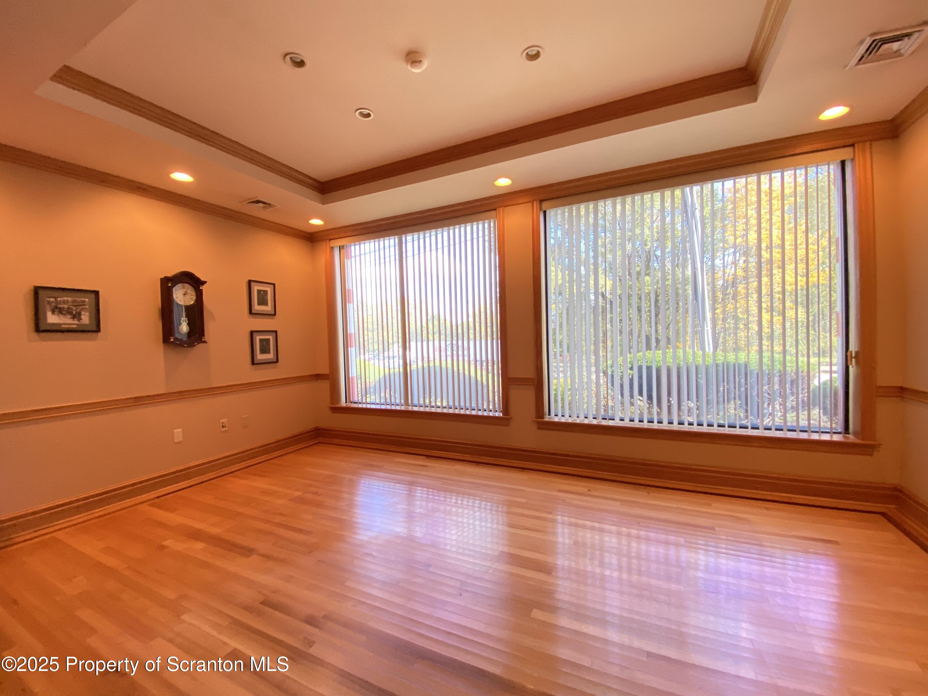 381 North 9th Avenue Scranton, PA 18504 - Photo 14 of 56 a view of an empty room with wooden floor and a window
