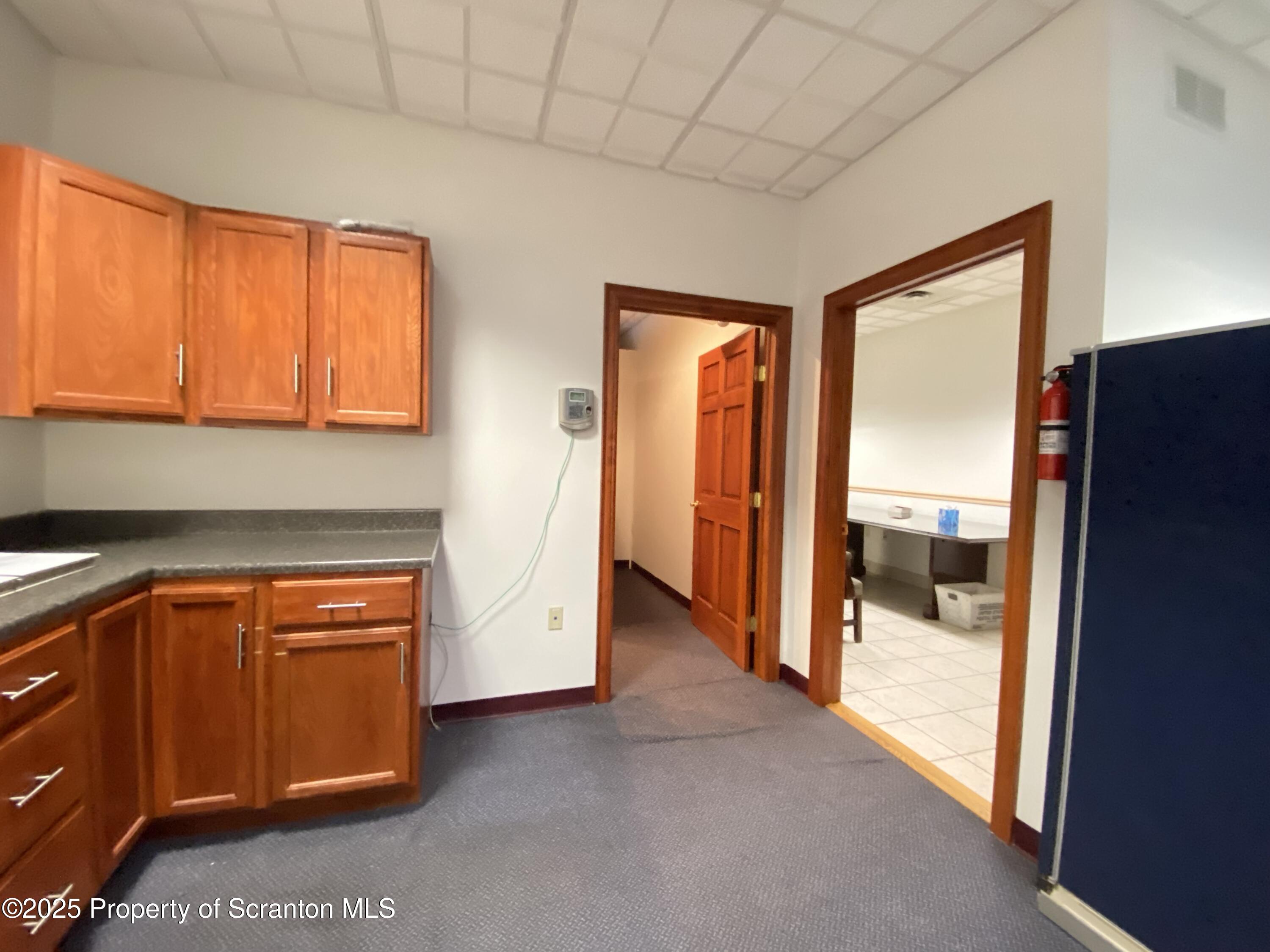 381 North 9th Avenue Scranton, PA 18504 - Photo 19 of 56 a view of a kitchen with large windows