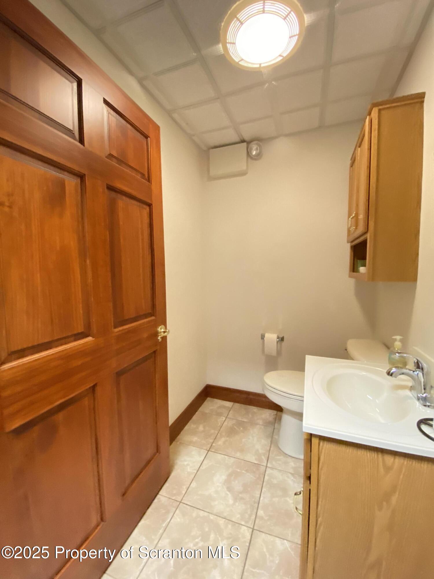 381 North 9th Avenue Scranton, PA 18504 - Photo 25 of 56 a bathroom with a sink and a mirror