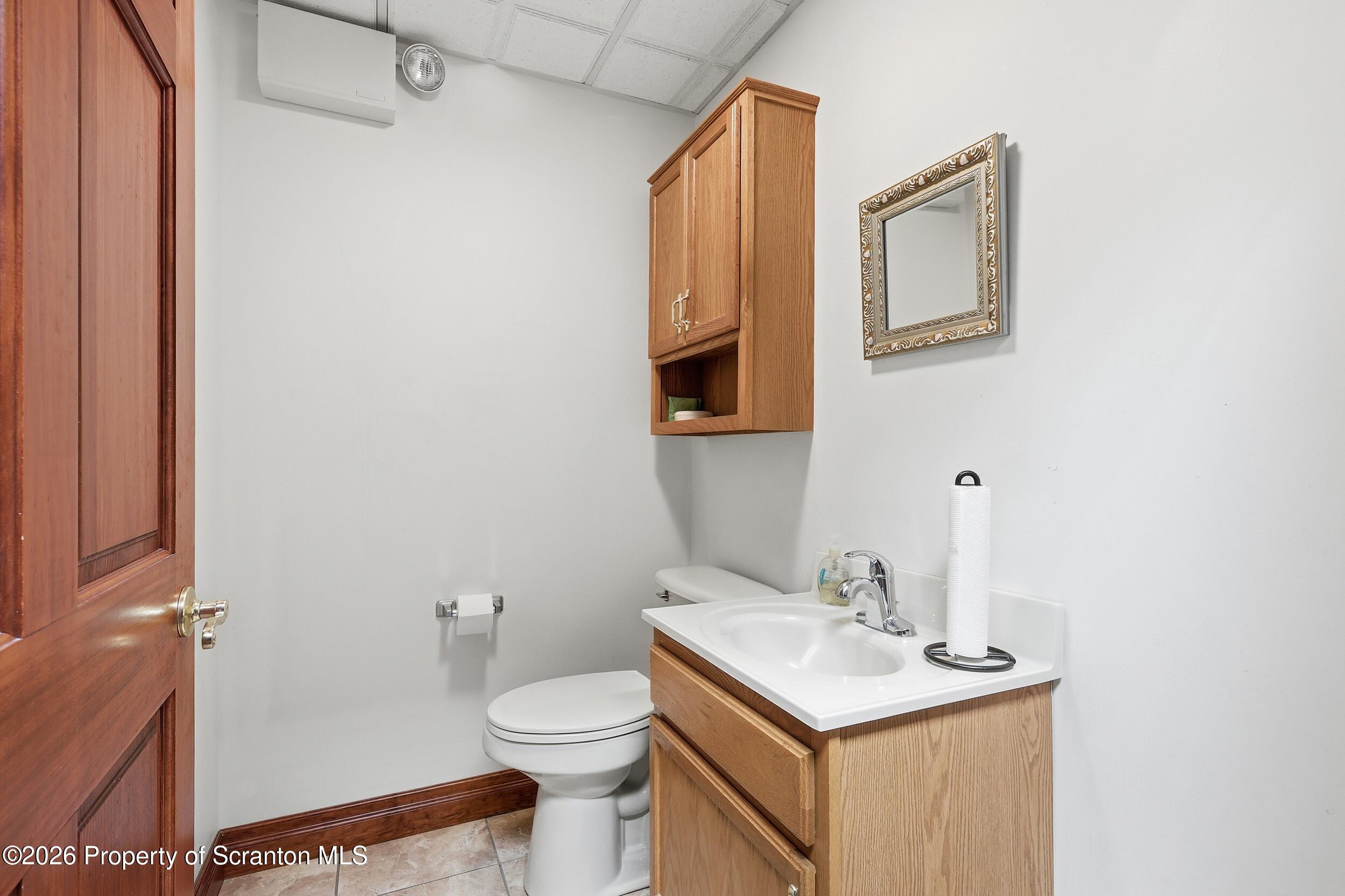 381 North 9th Avenue Scranton, PA 18504 - Photo 30 of 58 a bathroom with a sink toilet and mirror