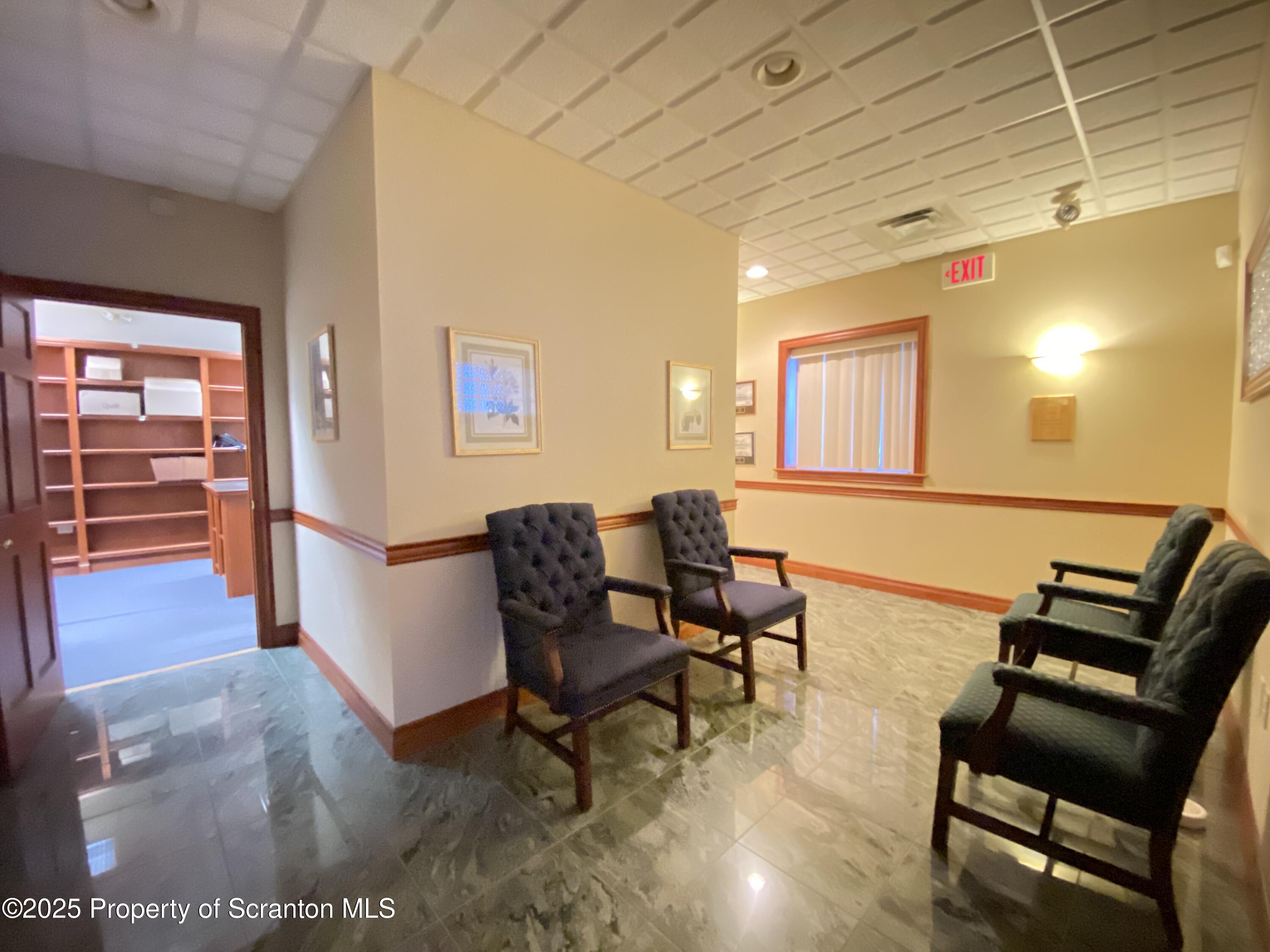 381 North 9th Avenue Scranton, PA 18504 - Photo 31 of 56 a living room with furniture and a gate
