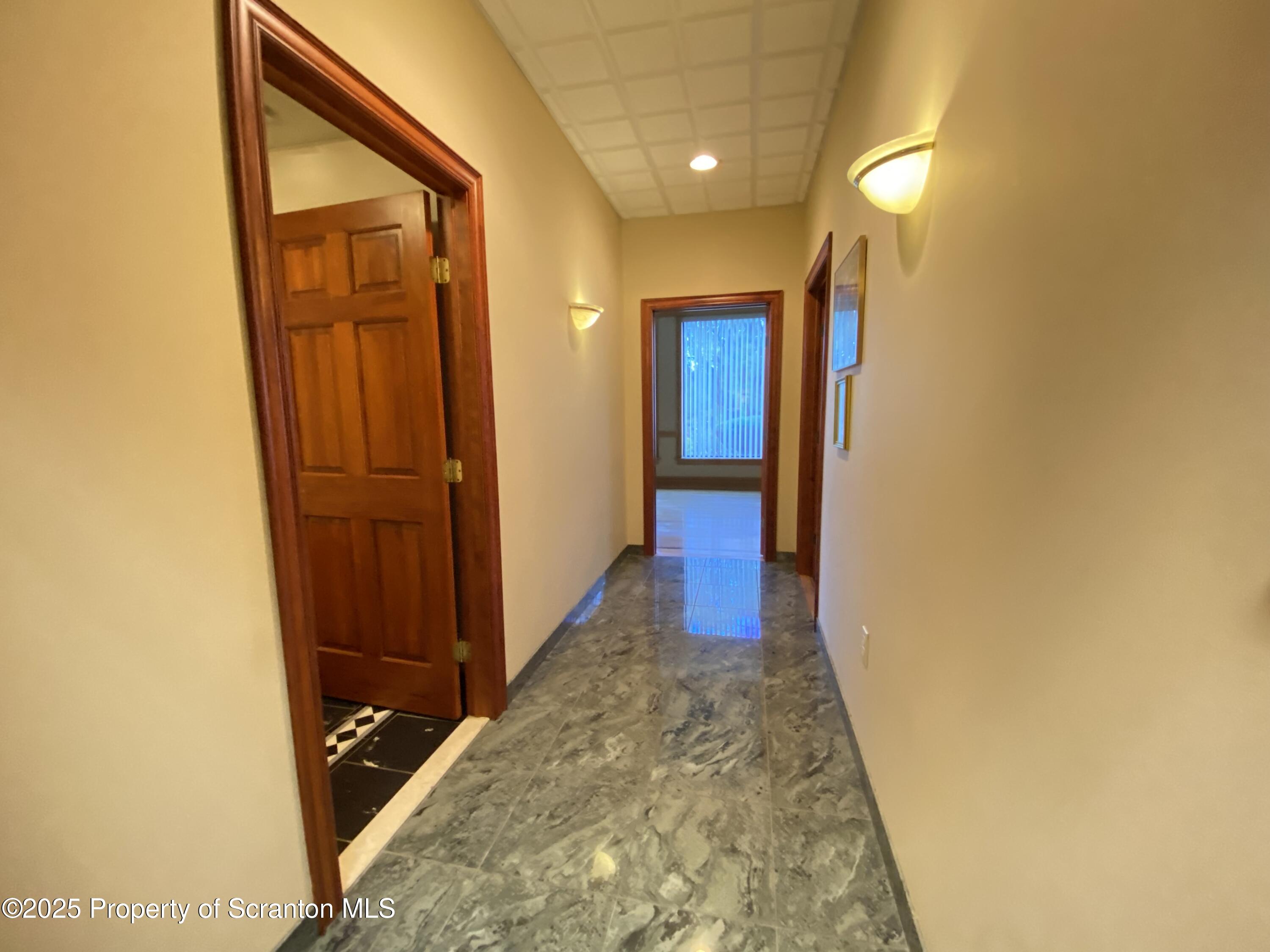 381 North 9th Avenue Scranton, PA 18504 - Photo 32 of 56 a view of a hallway with wooden floor and entryway