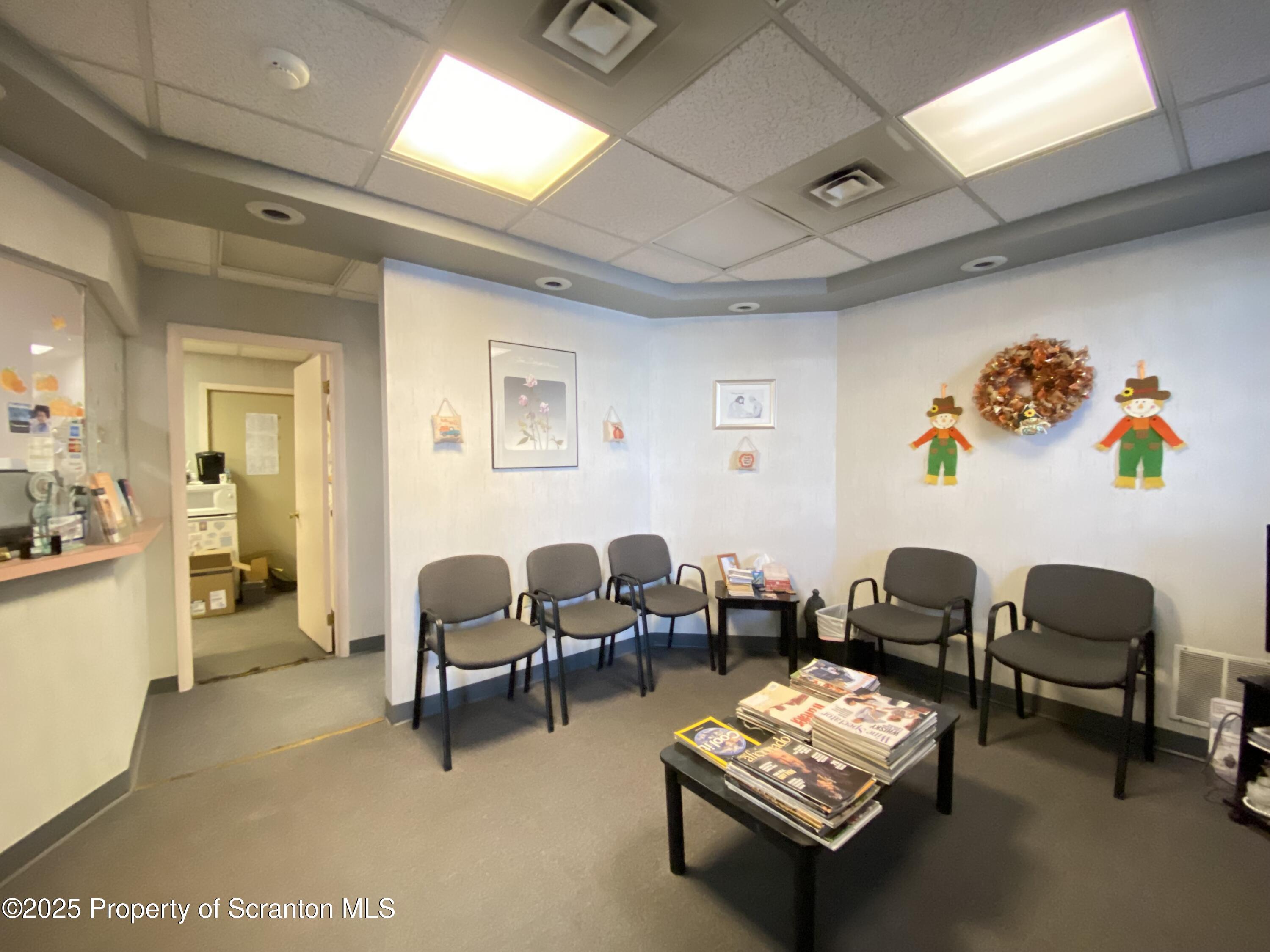 381 North 9th Avenue Scranton, PA 18504 - Photo 34 of 56 a living room with furniture and a table with wooden floor