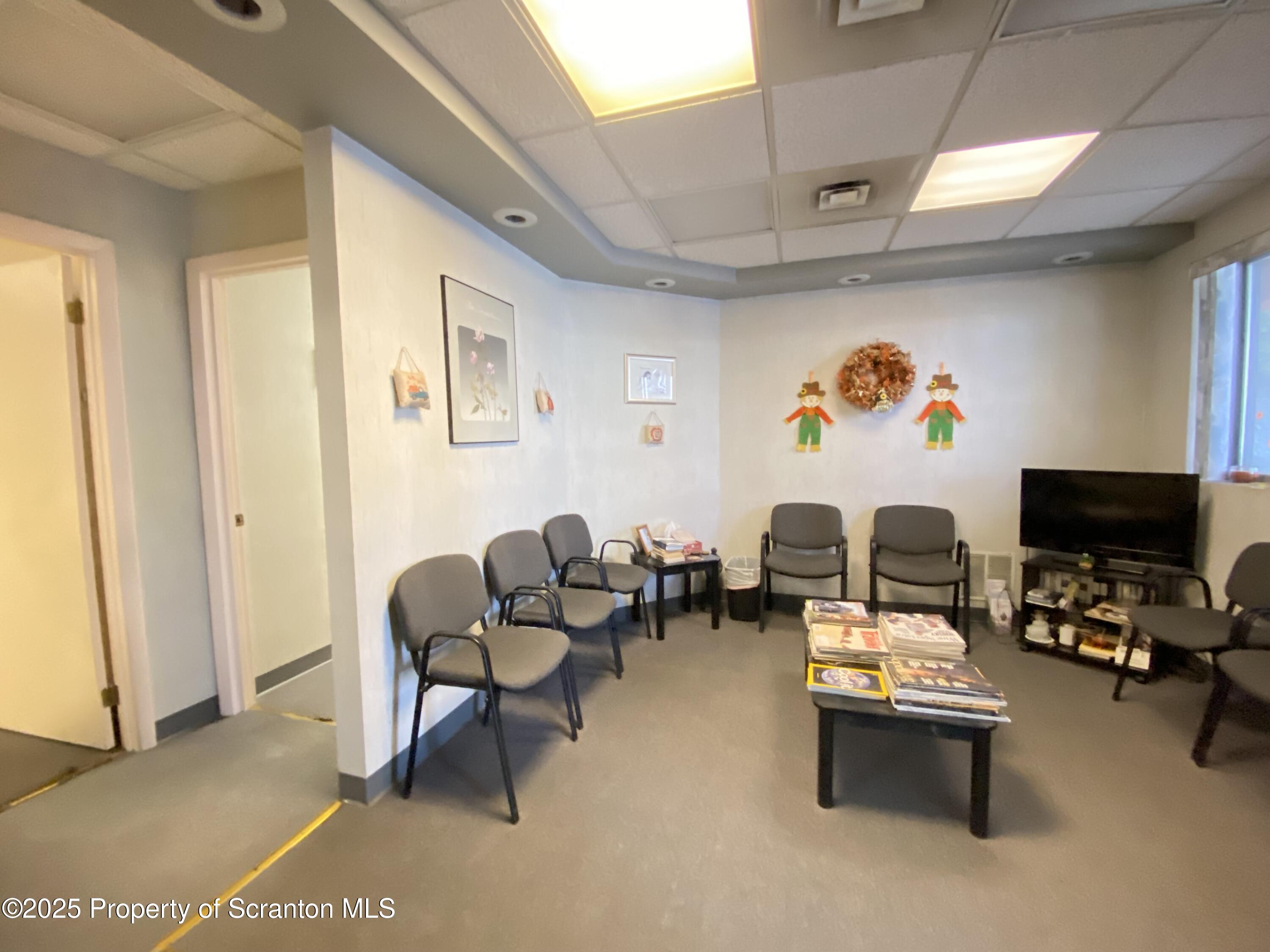 381 North 9th Avenue Scranton, PA 18504 - Photo 41 of 56 a living room with furniture and a flat screen tv