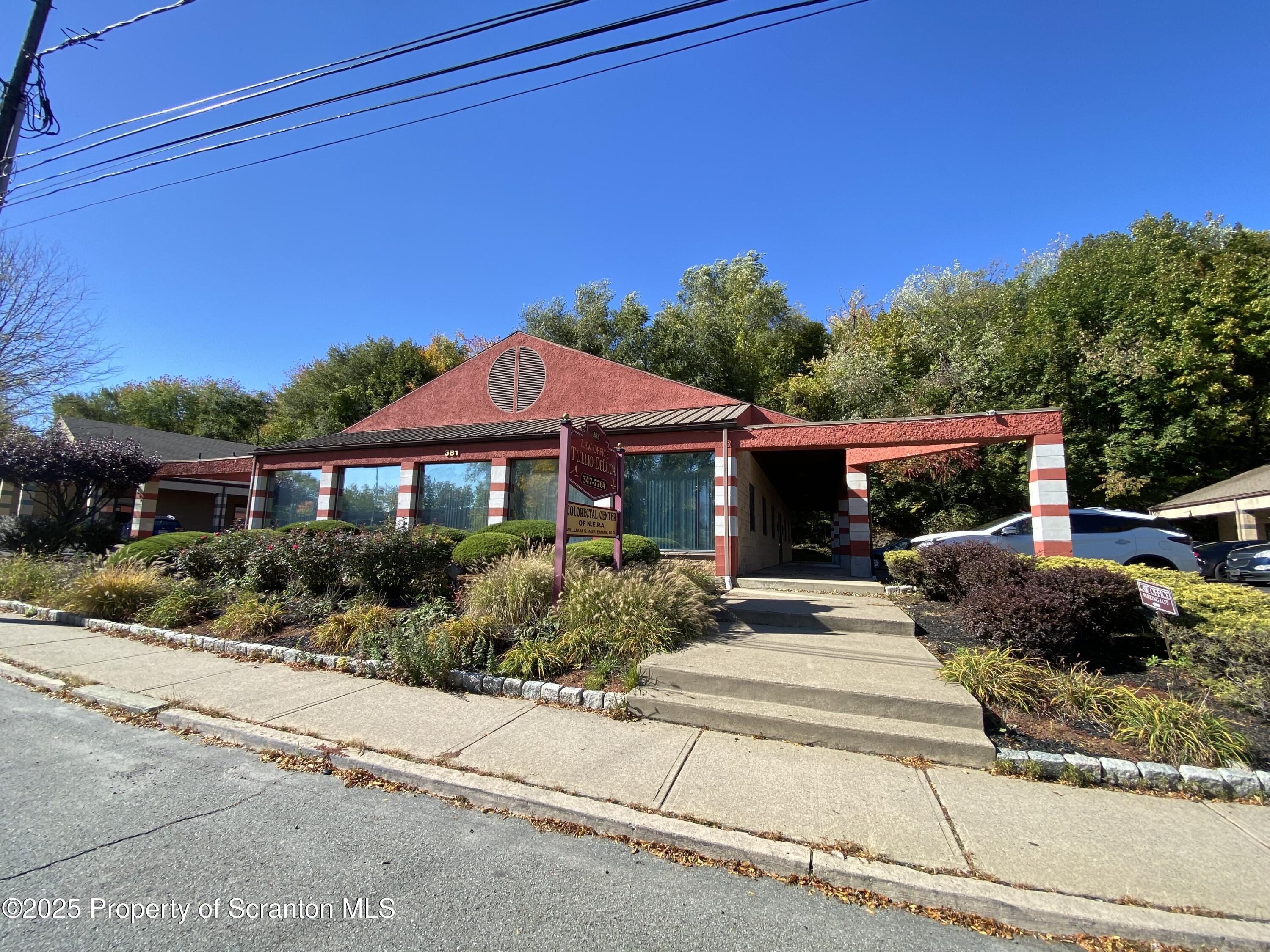 381 North 9th Avenue Scranton, PA 18504 - Photo 43 of 56 a front view of a house with a garden