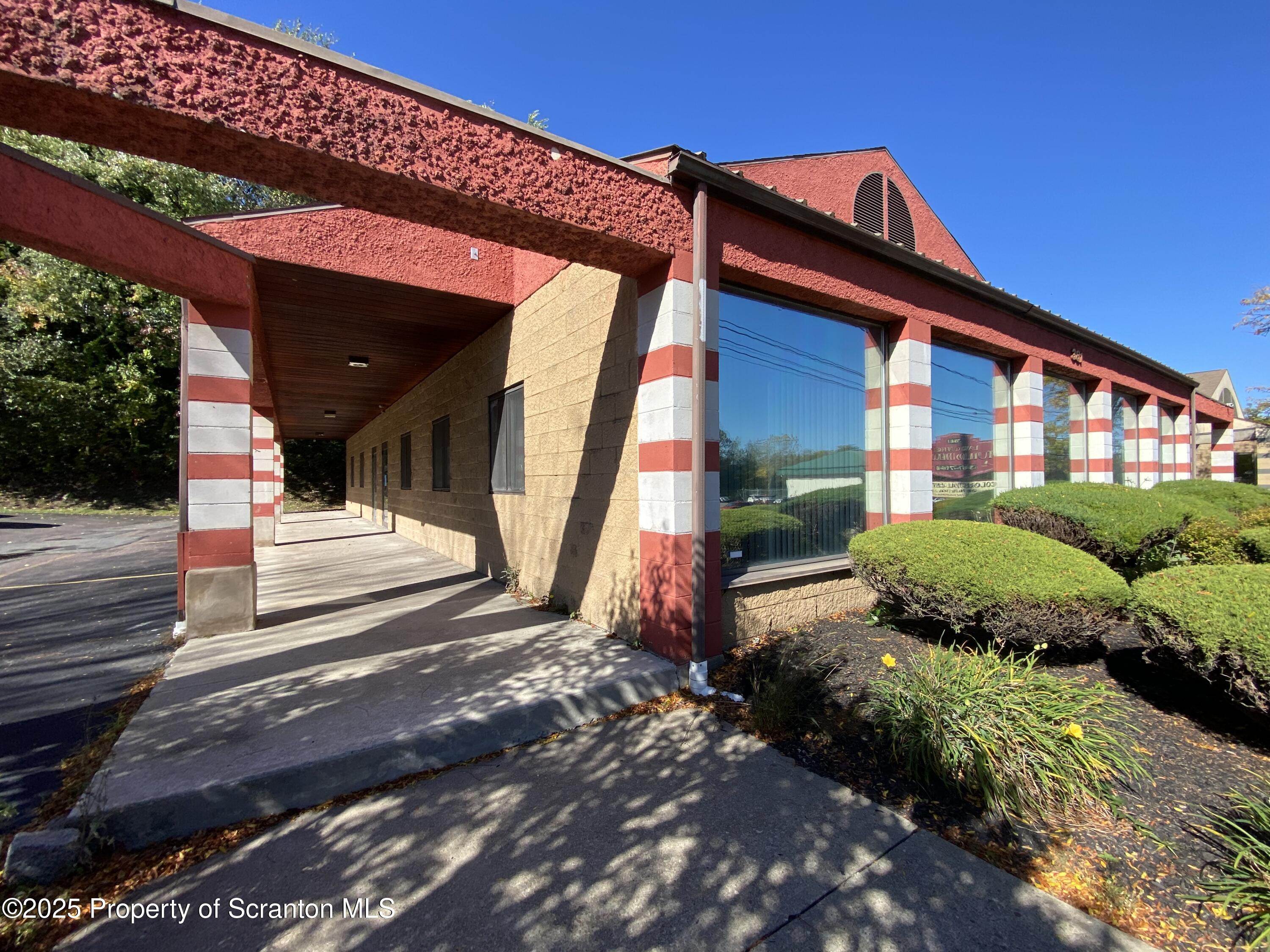 381 North 9th Avenue Scranton, PA 18504 - Photo 44 of 56 a front view of a house with garden