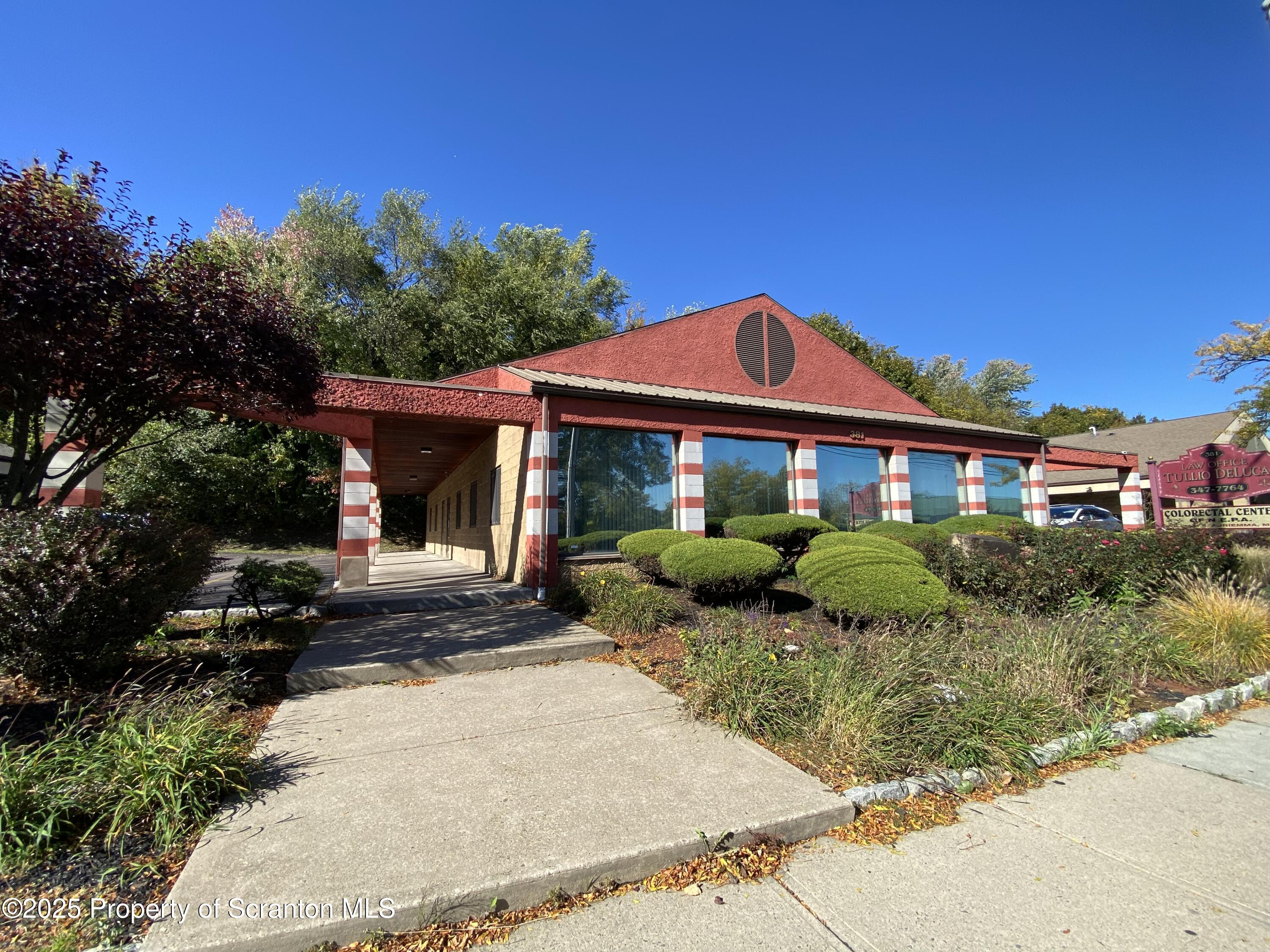 381 North 9th Avenue Scranton, PA 18504 - Photo 53 of 56 a front view of a house with a yard
