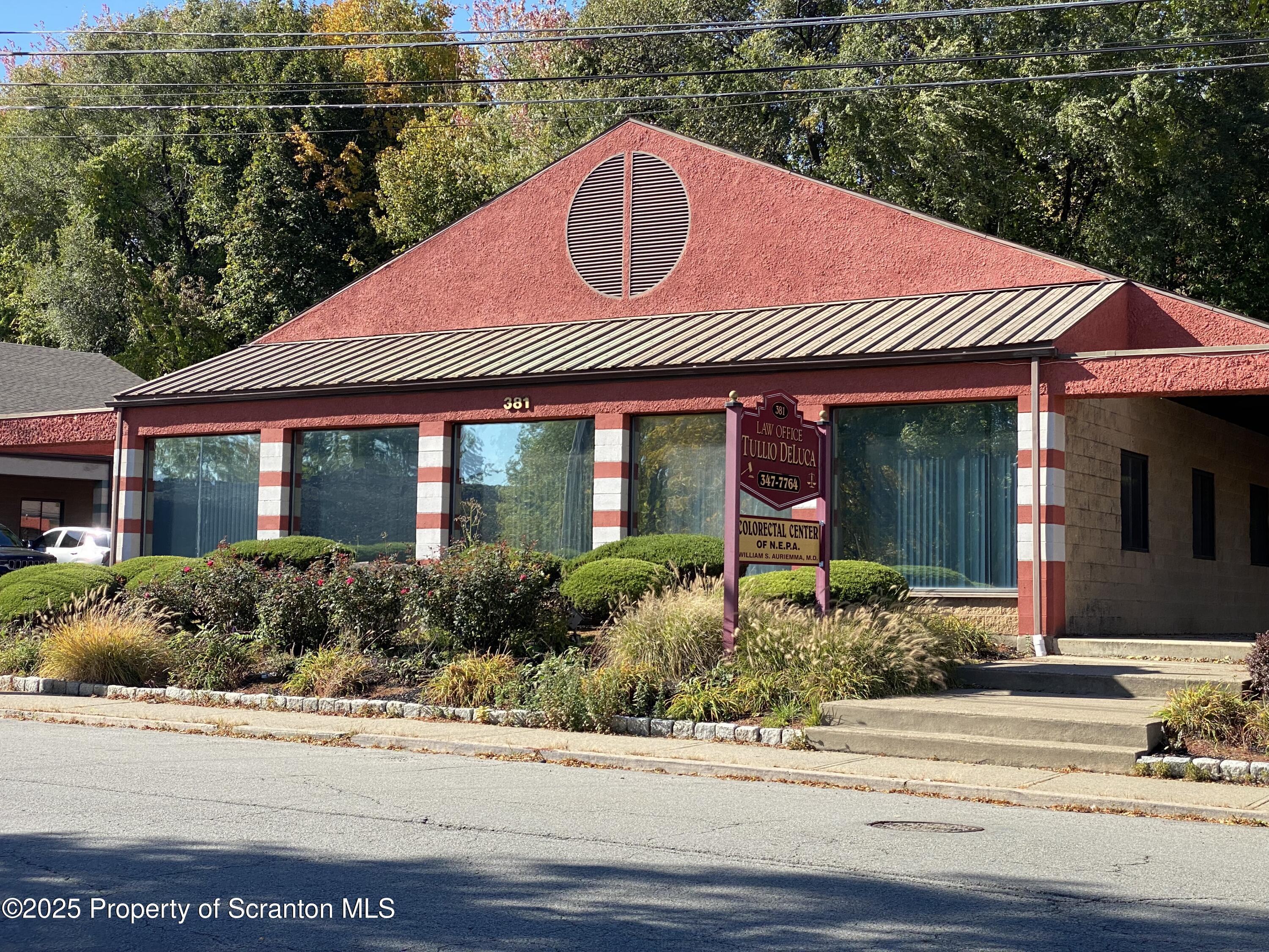 381 North 9th Avenue Scranton, PA 18504 - Photo 55 of 56 a front view of a house with garden