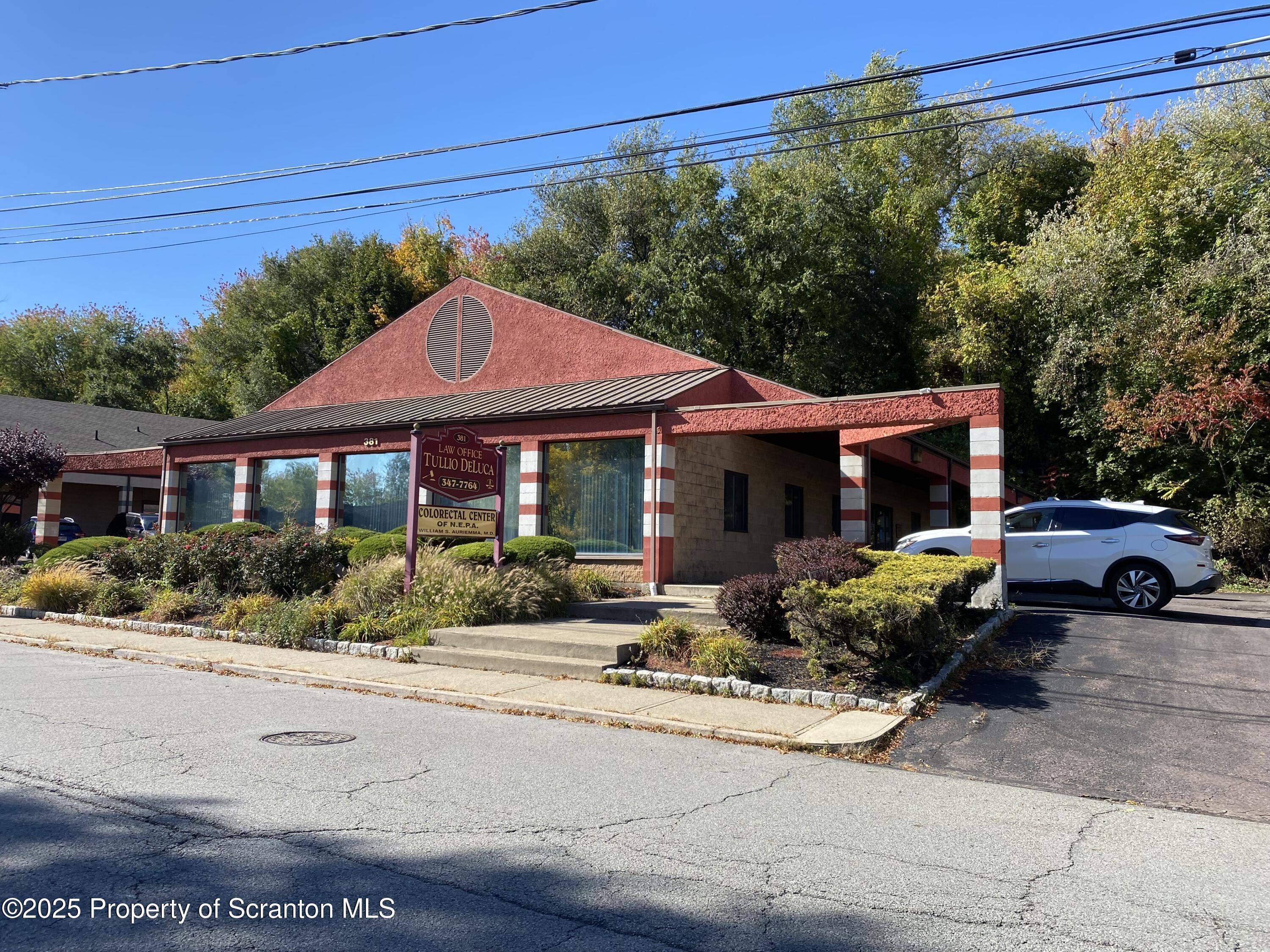381 North 9th Avenue Scranton, PA 18504 - Photo 56 of 56 a front view of a house with a yard