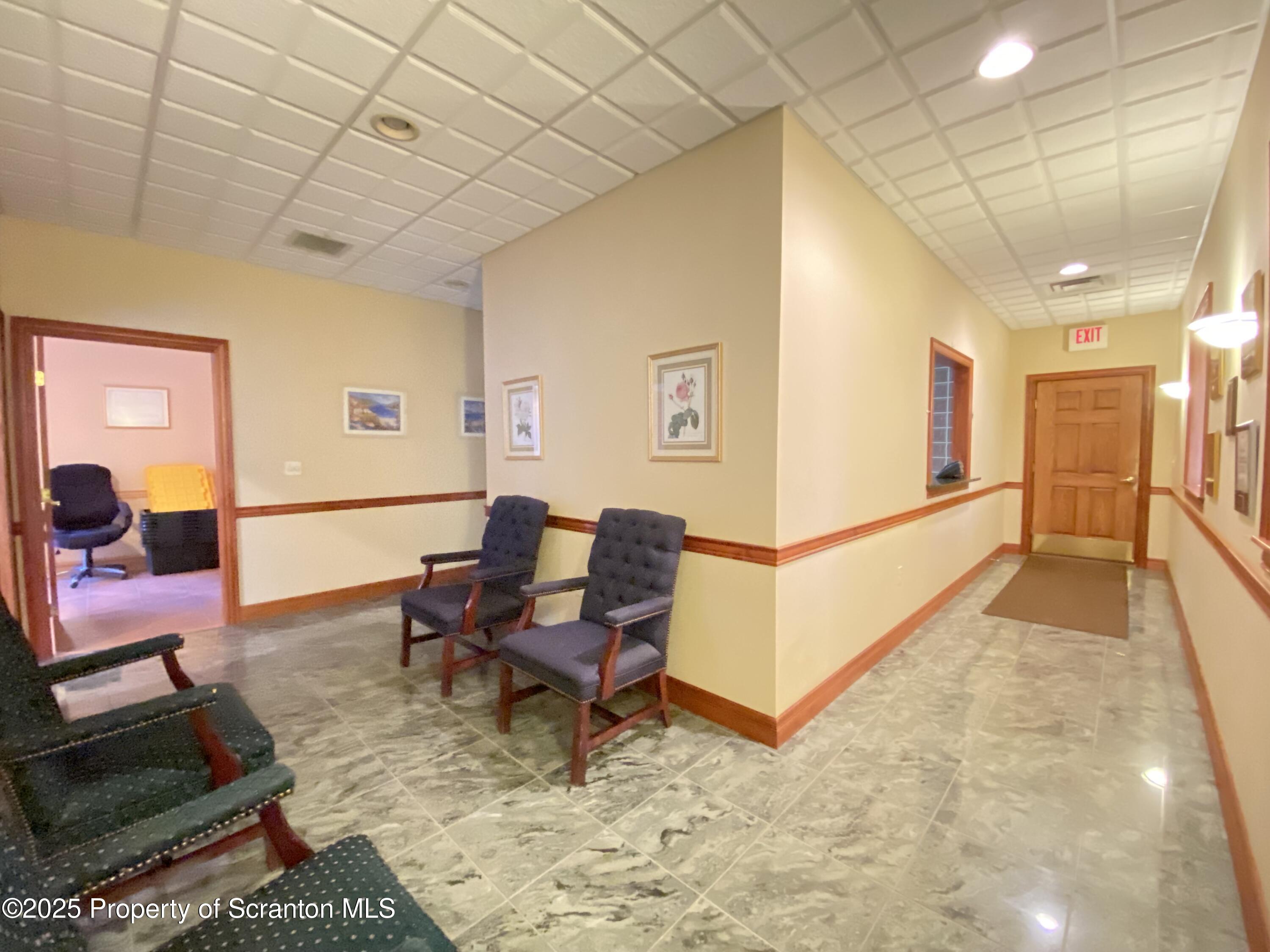 381 North 9th Avenue Scranton, PA 18504 - Photo 7 of 56 a living room with furniture and a dining table with wooden floor
