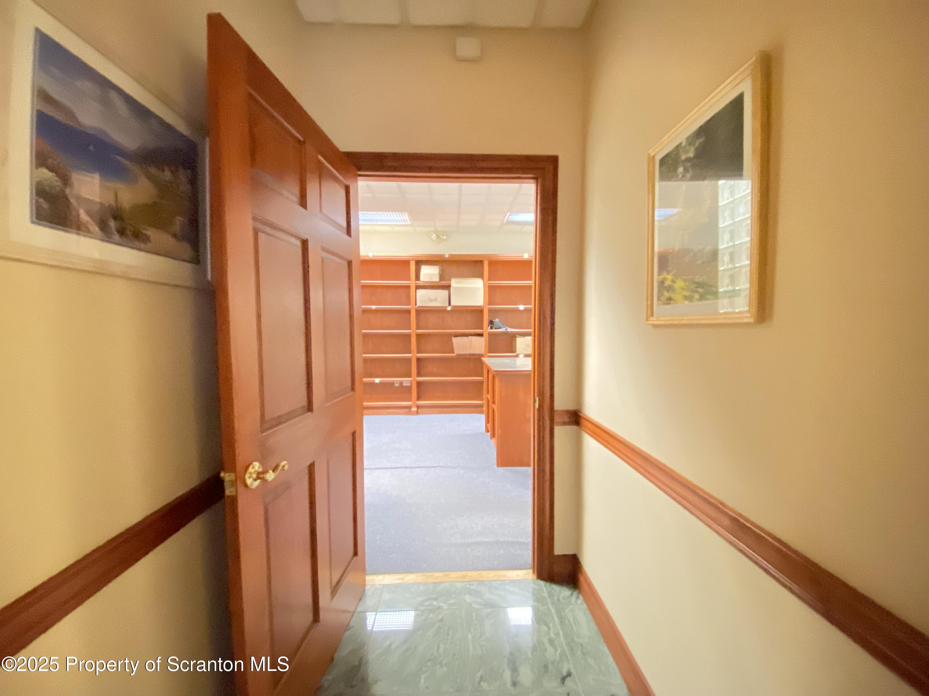 381 North 9th Avenue Scranton, PA 18504 - Photo 8 of 56 a view of a hallway with wooden floor and staircase