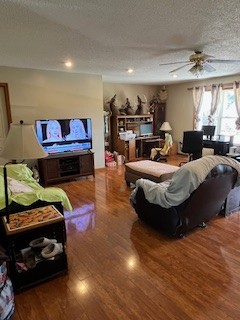 667 Maple Bend Road Winchester, TN 37398 - Photo 11 of 33 a bedroom with furniture and a wooden floor