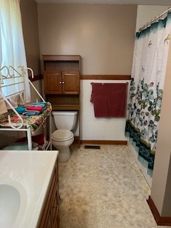 667 Maple Bend Road Winchester, TN 37398 - Photo 16 of 33 a living room with a couch and a stove next to a window