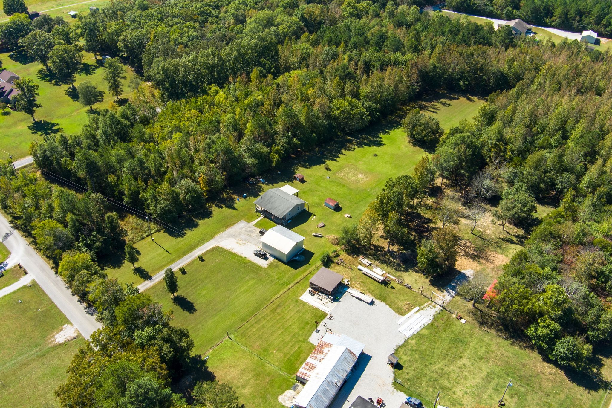 667 Maple Bend Road Winchester, TN 37398 - Photo 29 of 33 an aerial view of residential houses with outdoor space and trees