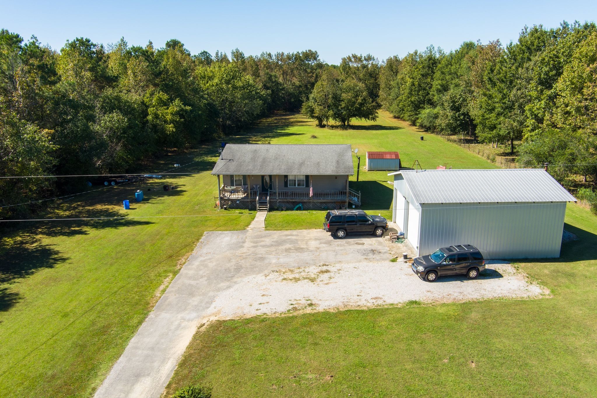 667 Maple Bend Road Winchester, TN 37398 - Photo 3 of 33 a view of swimming pool with seating area and trees in the background