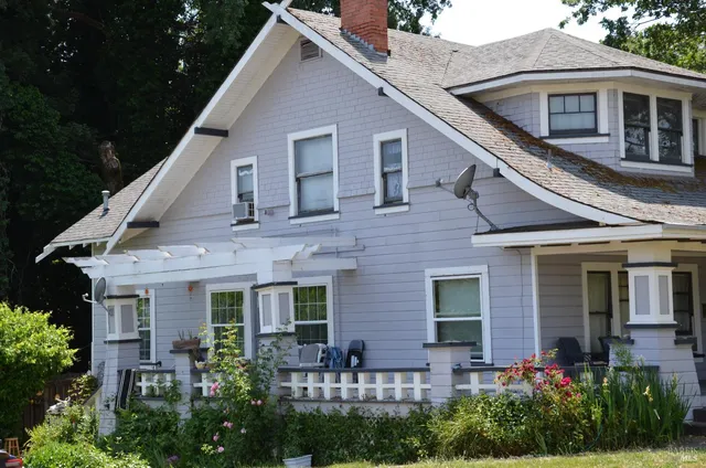 a front view of a house with garden