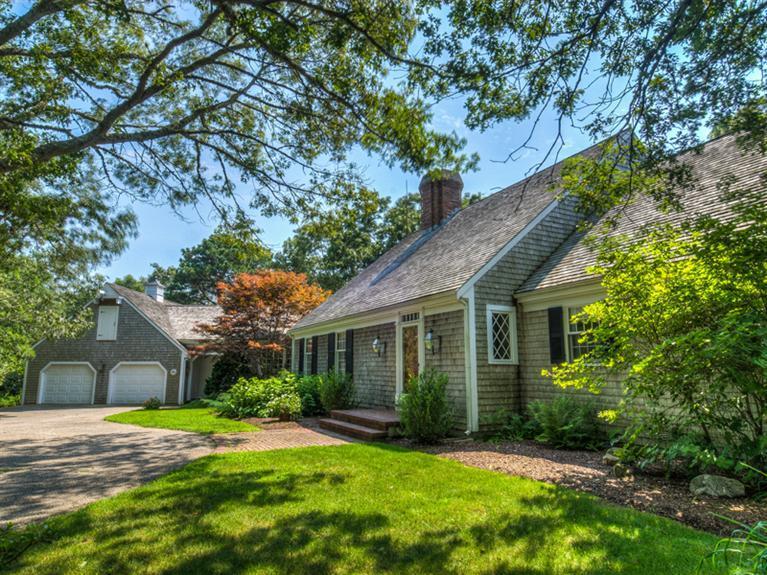 414 Baxter Neck Road Marstons Mills, MA 02648 - Photo 1 of 20 a view of a house next to a big yard and large trees