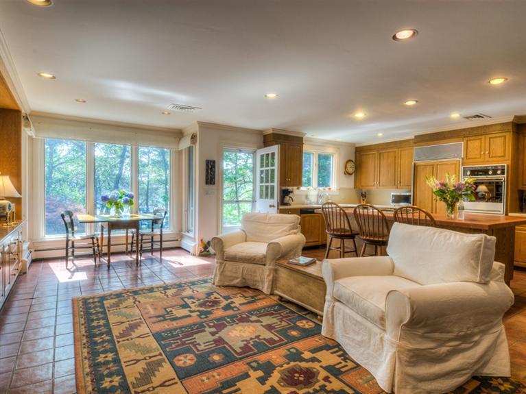 414 Baxter Neck Road Marstons Mills, MA 02648 - Photo 11 of 20 a living room with furniture and a table