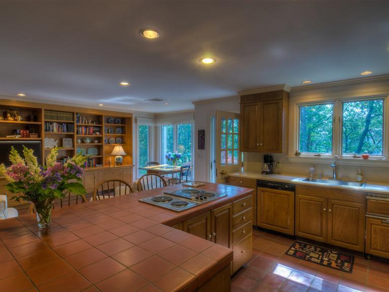 414 Baxter Neck Road Marstons Mills, MA 02648 - Photo 14 of 20 a kitchen with lots of counter top space and dining table