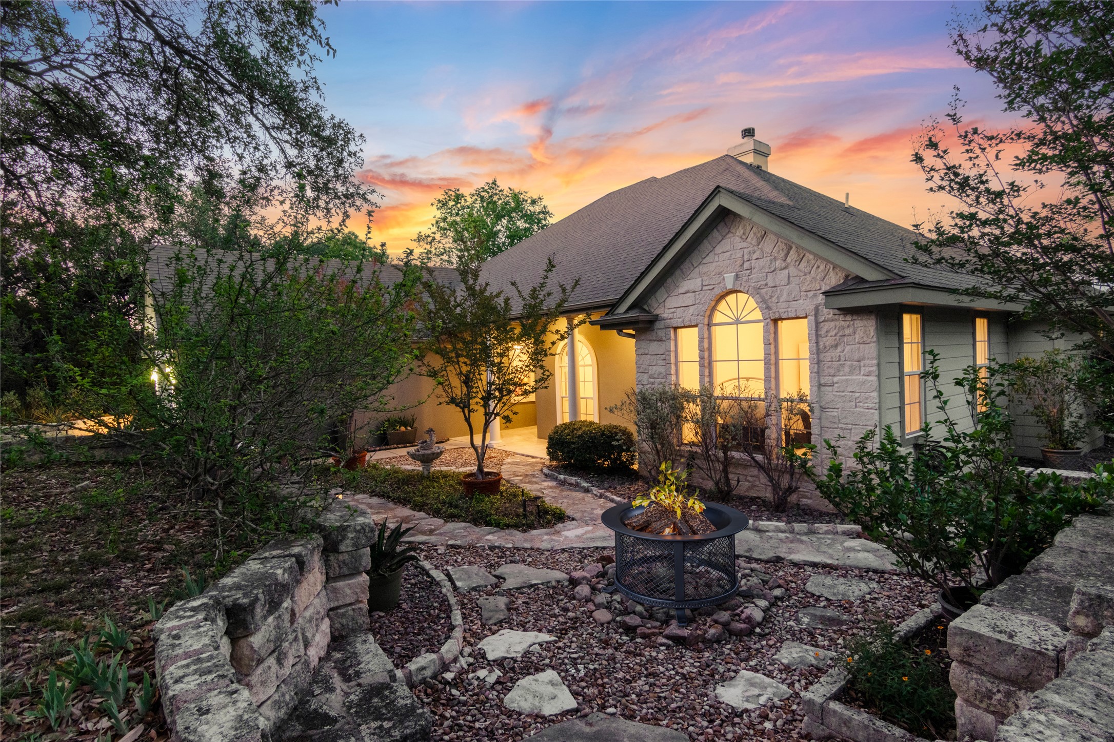 18408 West Rim Drive Jonestown, TX 78645 - Photo 26 of 30 a front view of a house with garden