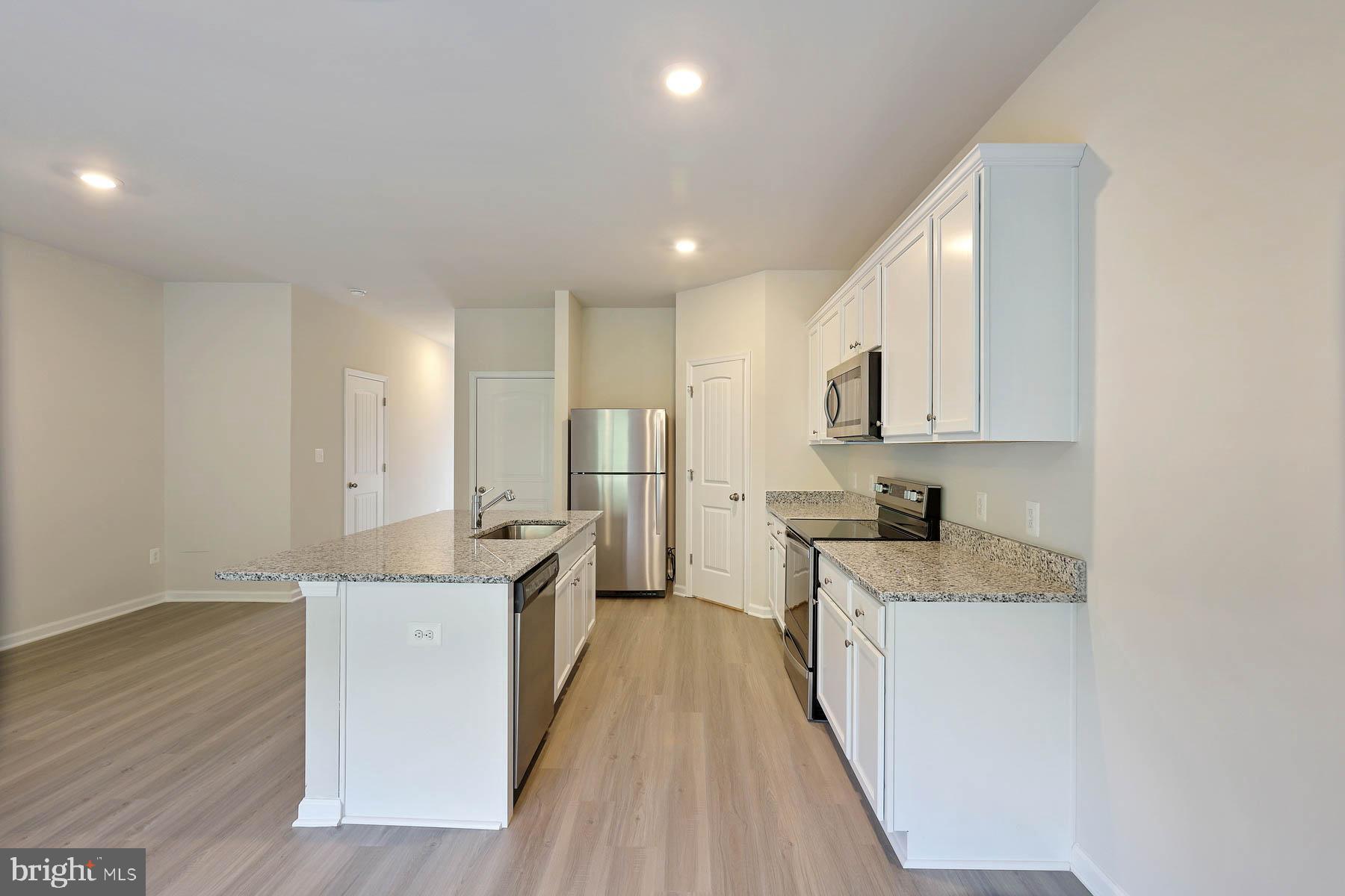 64 Paddington Street Falling Waters, WV 25419 - Photo 3 of 10 Beautiful white cabinets and granite countertops!