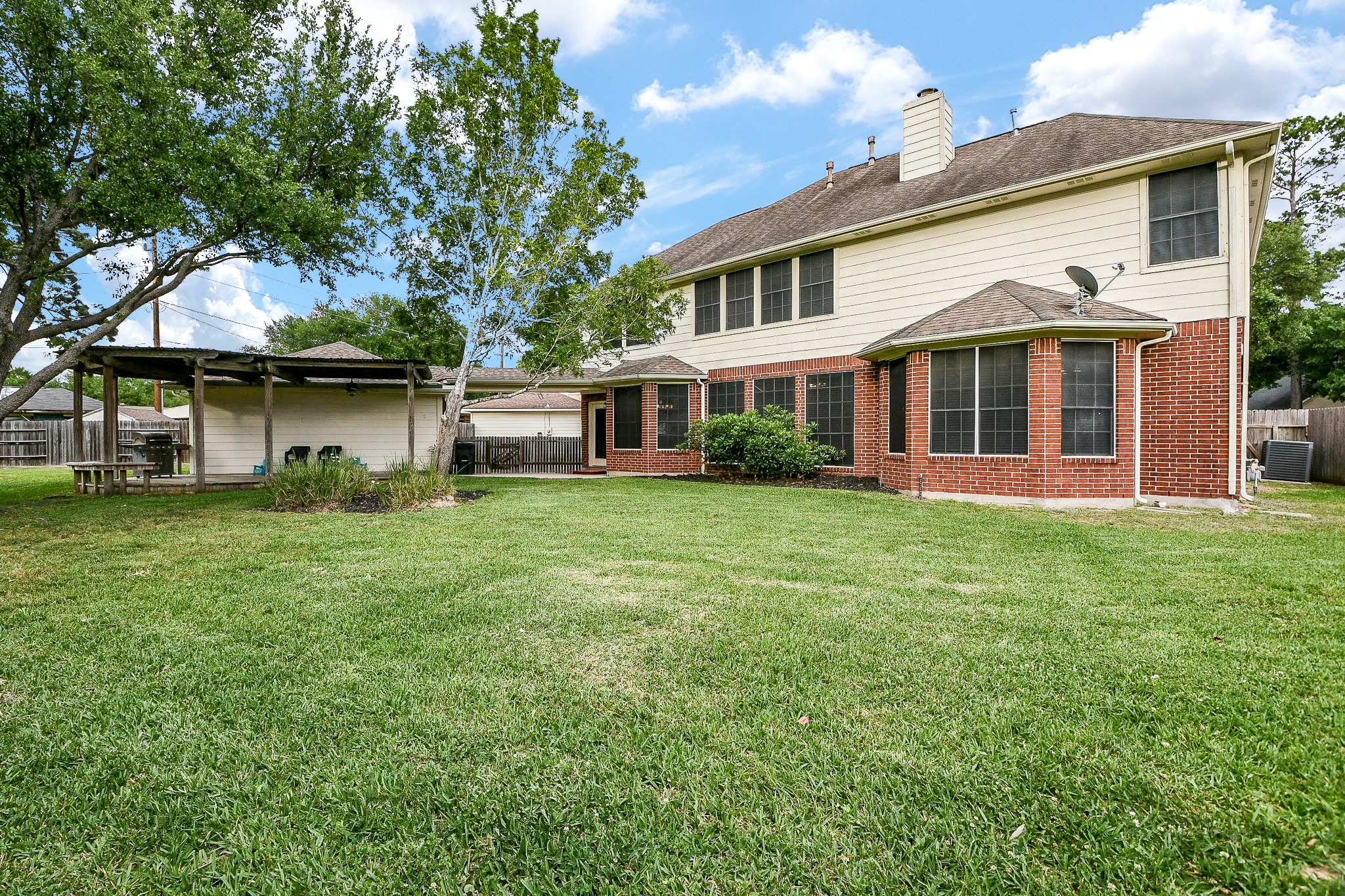 20423 Forest Drive Spring, TX 77388 - Photo 45 of 49 a front view of a house with a garden and lake view