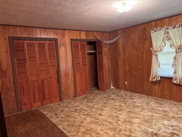 a view of a room with a wooden walls