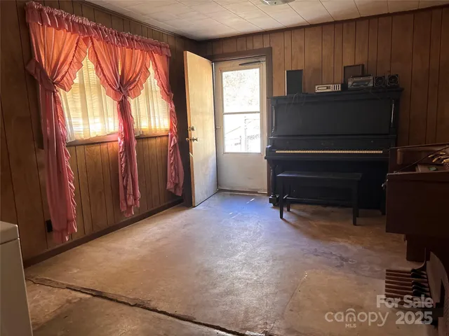 a view of room with a large window and couch