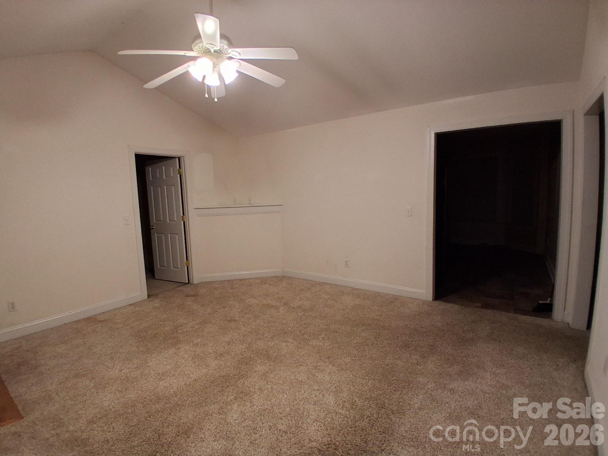 443 Tranquil Lane Willow Spring, NC 27592 - Photo 12 of 21 an empty room with closet and a chandelier fan