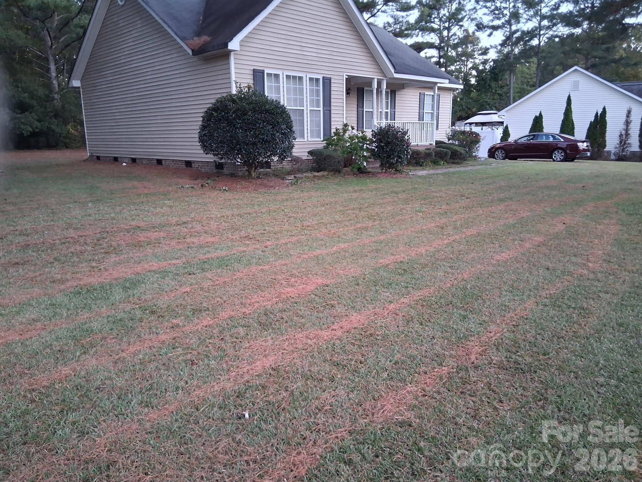 443 Tranquil Lane Willow Spring, NC 27592 - Photo 3 of 21 a front view of a house with a yard and garage