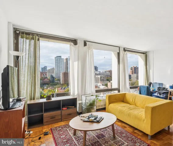 a living room with furniture and a large window