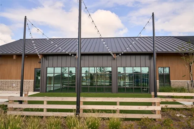 a front view of house with yard and outdoor seating
