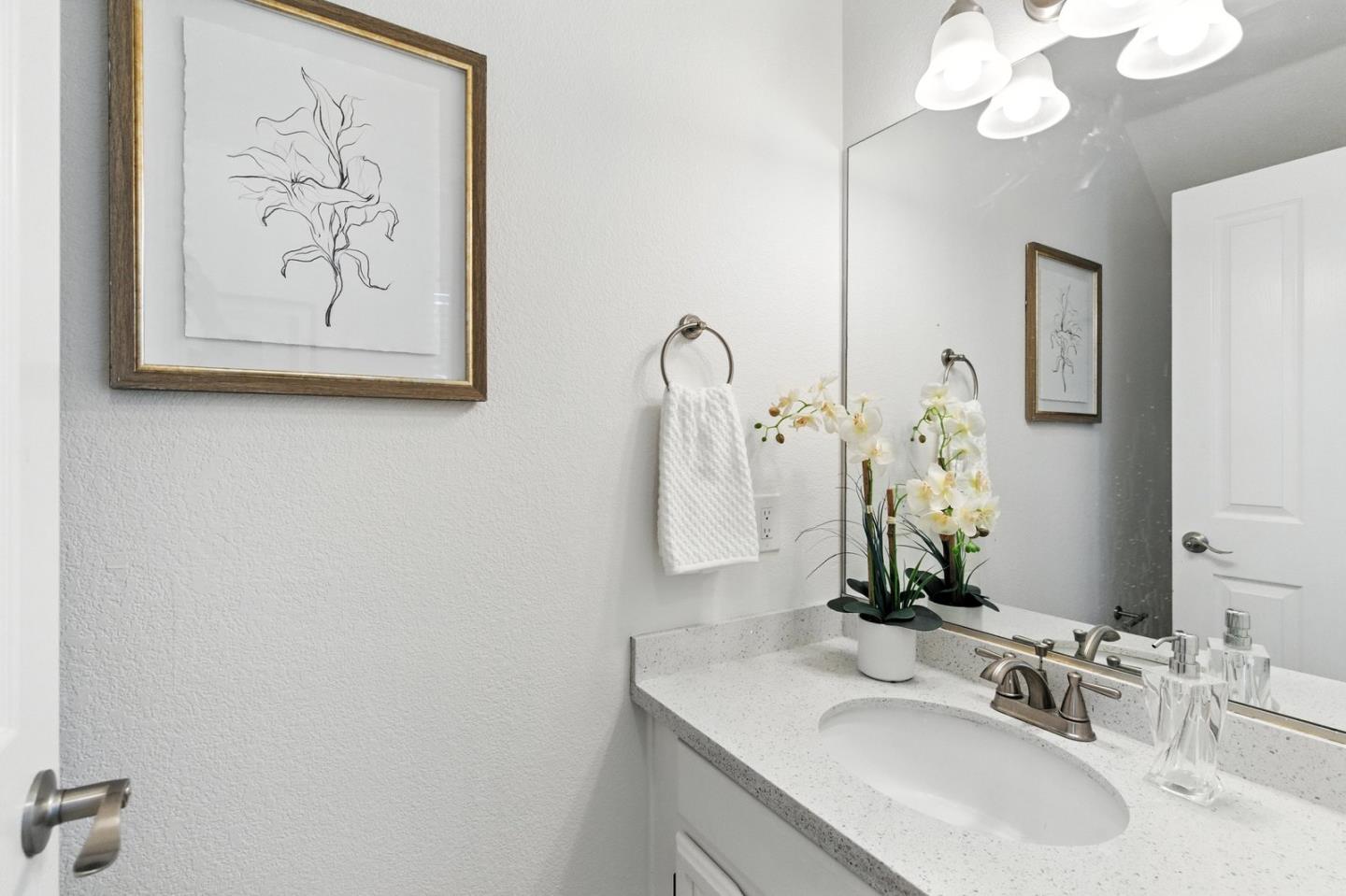 113 East Rincon Avenue Campbell, CA 95008 - Photo 11 of 26 a bathroom with a sink and a mirror
