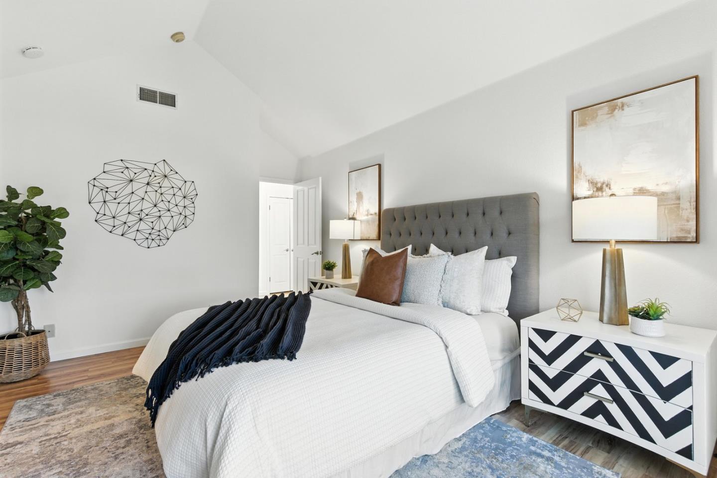 113 East Rincon Avenue Campbell, CA 95008 - Photo 14 of 26 a bedroom with a bed and a lamp