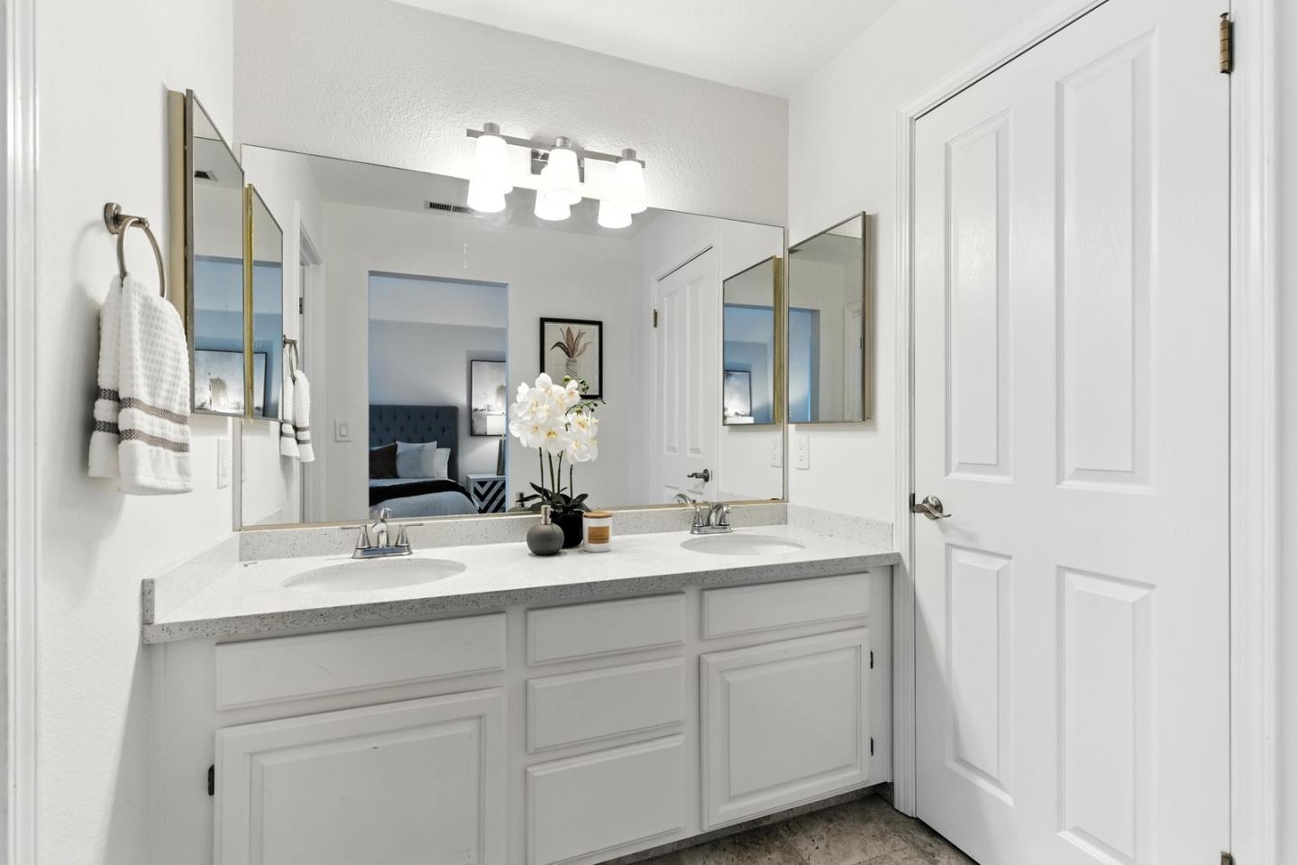 113 East Rincon Avenue Campbell, CA 95008 - Photo 15 of 26 a bathroom with a double vanity sink and a mirror