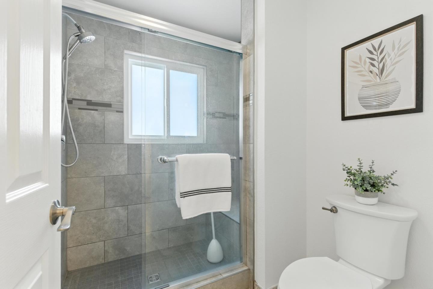113 East Rincon Avenue Campbell, CA 95008 - Photo 16 of 26 a bathroom with a toilet and a shower