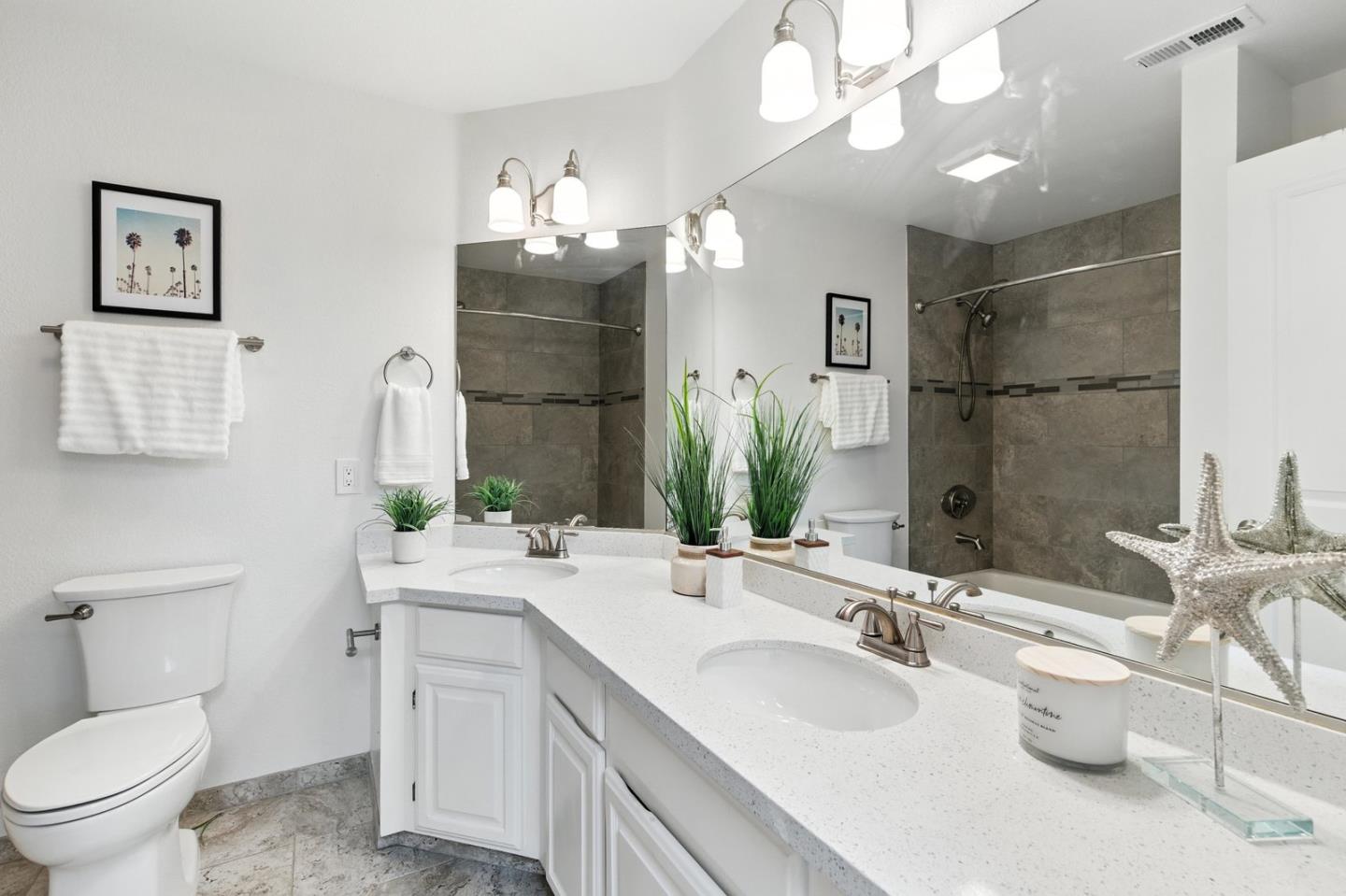 113 East Rincon Avenue Campbell, CA 95008 - Photo 18 of 26 a bathroom with a double vanity sink mirror and toilet