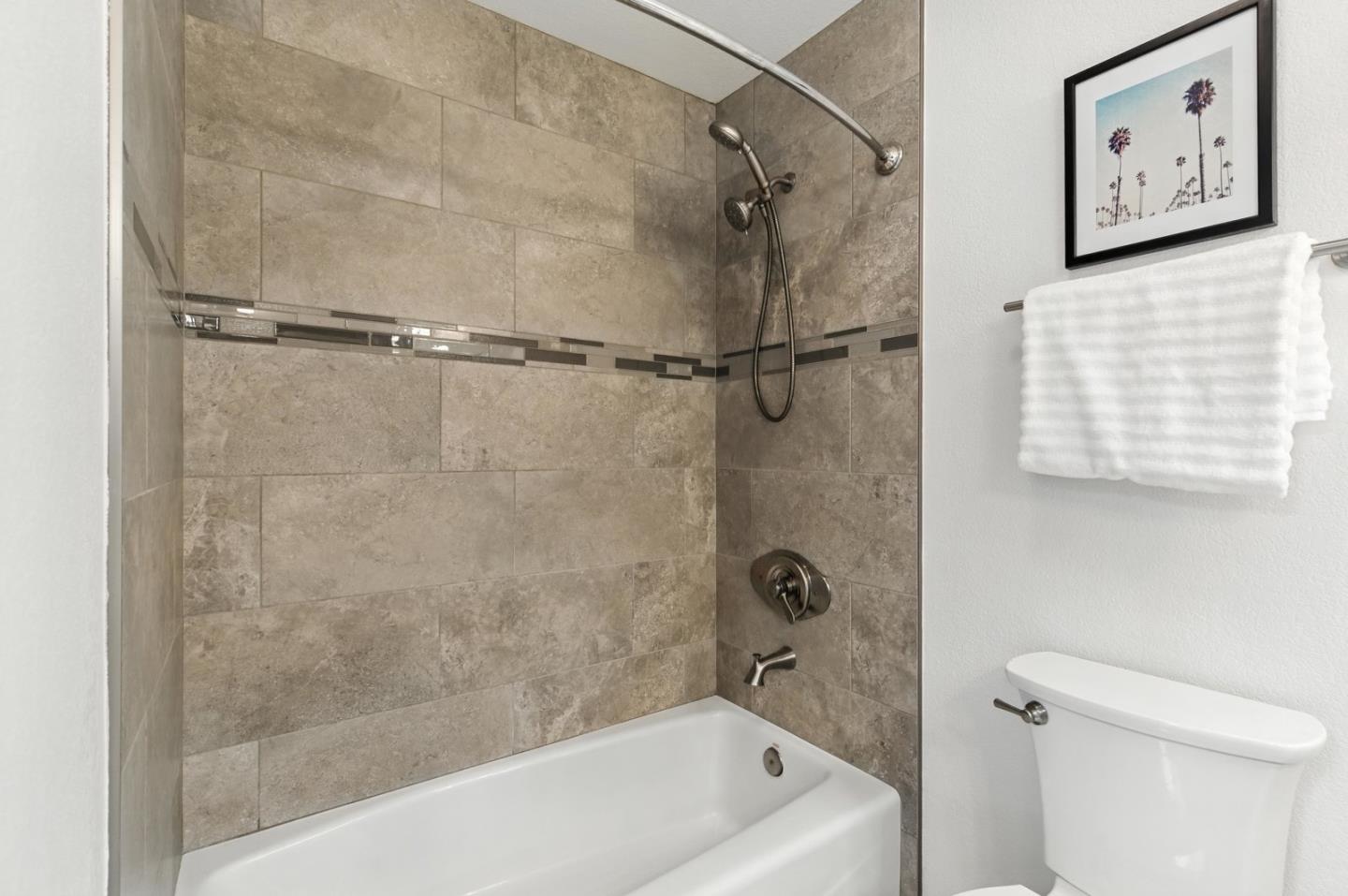 113 East Rincon Avenue Campbell, CA 95008 - Photo 19 of 26 a bath tub sitting next to a white toilet and sink