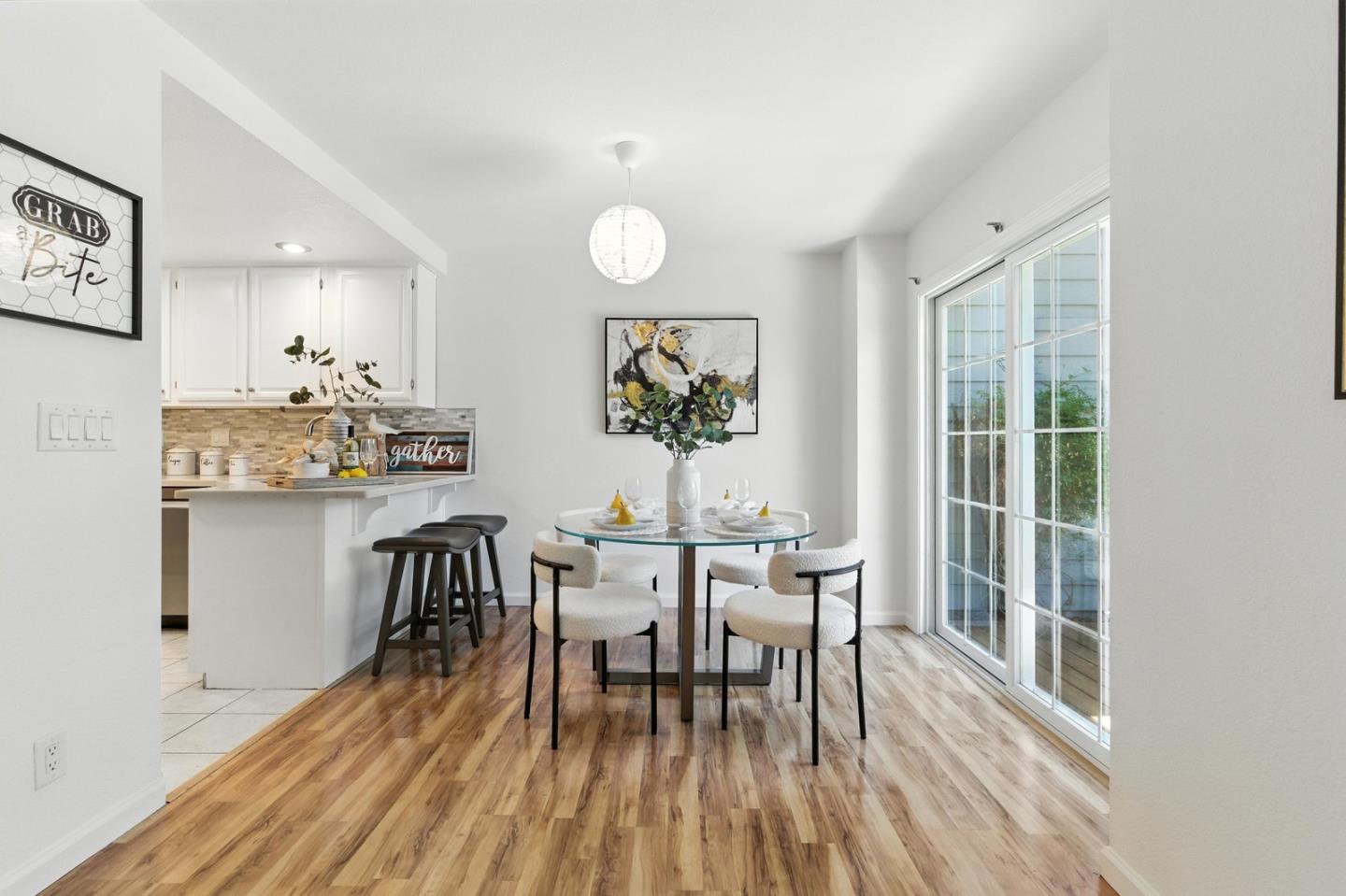 113 East Rincon Avenue Campbell, CA 95008 - Photo 8 of 26 a view of a dining room with furniture and wooden floor