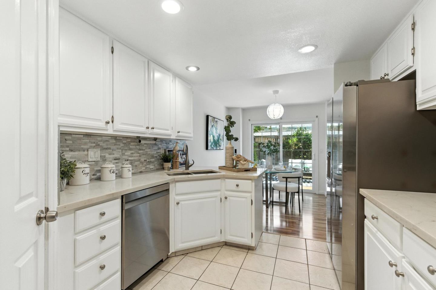 113 East Rincon Avenue Campbell, CA 95008 - Photo 9 of 26 a kitchen with white cabinets and white appliances
